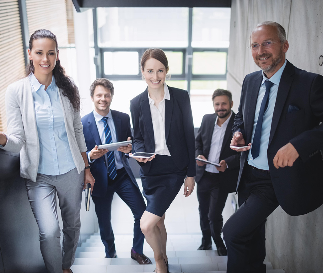 group confident businesspeople office min 1